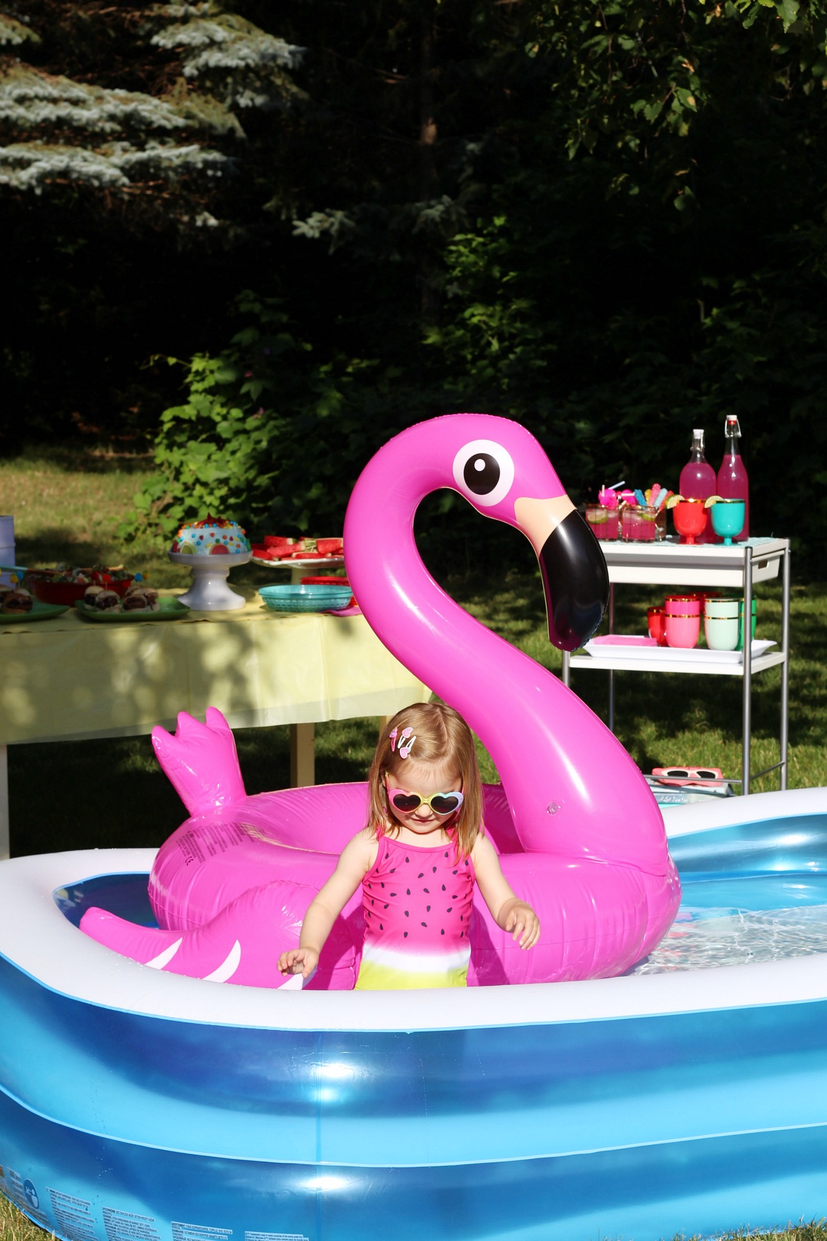 Summer fun pool party with pink flamingo pool float