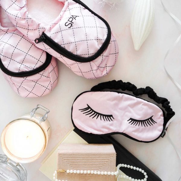 pink slippers and pink sleep mask